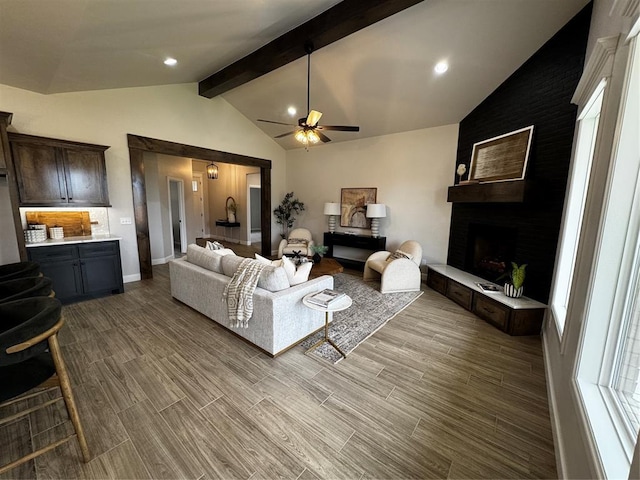 10421 SW 50th St, Mustang, OK 73064 - living area with a ceiling fan, wood finished floors, and a fireplace