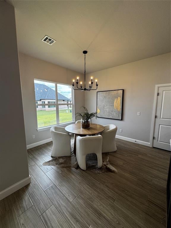 10421 SW 50th St, Mustang, OK 73064 - dining room with a chandelier and dark wood-style flooring