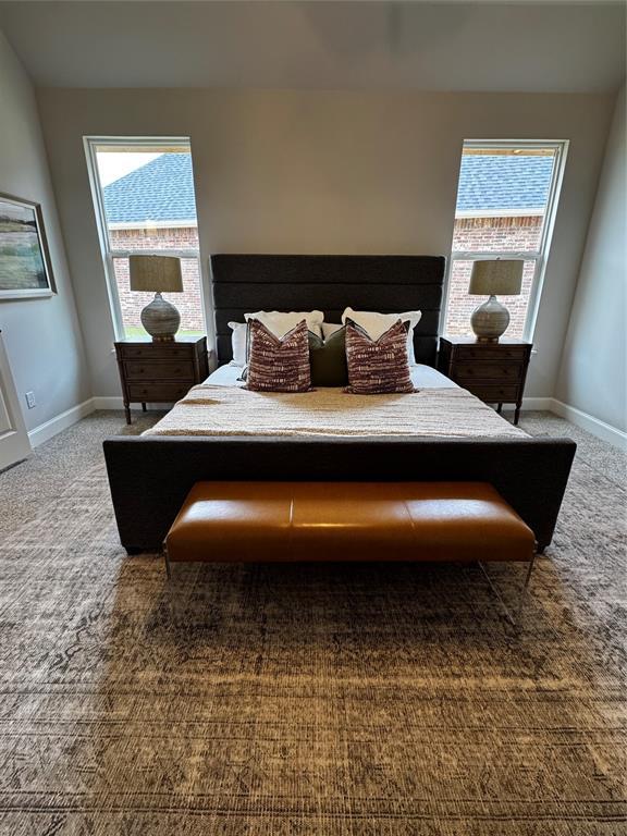 10421 SW 50th St, Mustang, OK 73064 - carpeted bedroom featuring baseboards