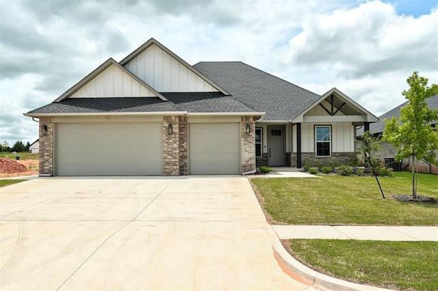 10440 SW 50th St, Mustang, OK 73064 - craftsman-style home featuring board and batten siding, a garage, driveway, roof with shingles, and a front lawn