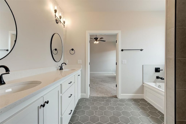 10440 SW 50th St, Mustang, OK 73064 - bathroom with ceiling fan, double vanity, a bath, tile patterned floors, and baseboards