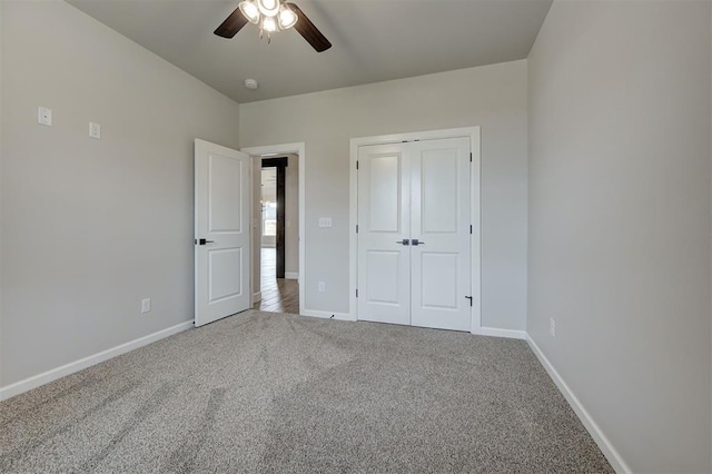 10440 SW 50th St, Mustang, OK 73064 - unfurnished bedroom with carpet floors, baseboards, a closet, and a ceiling fan