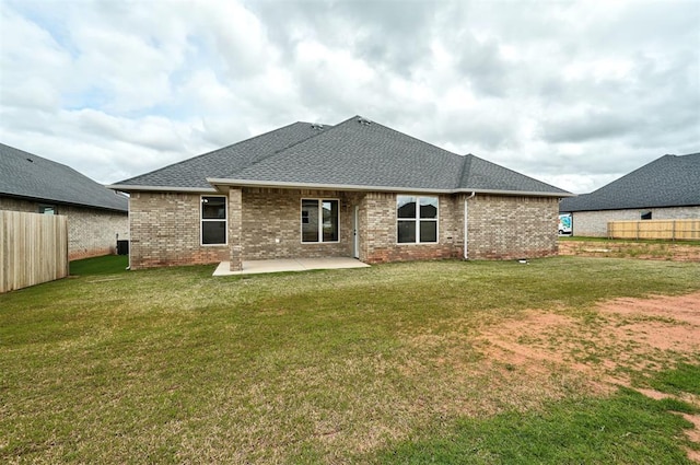 10440 SW 50th St, Mustang, OK 73064 - back of property featuring a patio, brick siding, and a shingled roof