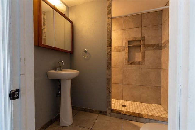 3701 NW 18th St, Oklahoma City, OK 73107 - full bath featuring tiled shower, tile patterned flooring, a sink, toilet, and baseboards
