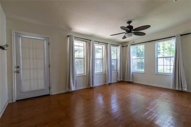 3701 NW 18th St, Oklahoma City, OK 73107 - spare room with wood finished floors, plenty of natural light, a ceiling fan, and baseboards