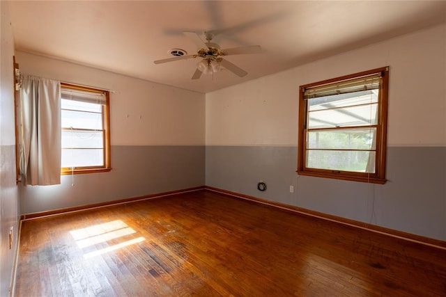 3701 NW 18th St, Oklahoma City, OK 73107 - spare room with wood-type flooring, a ceiling fan, and baseboards