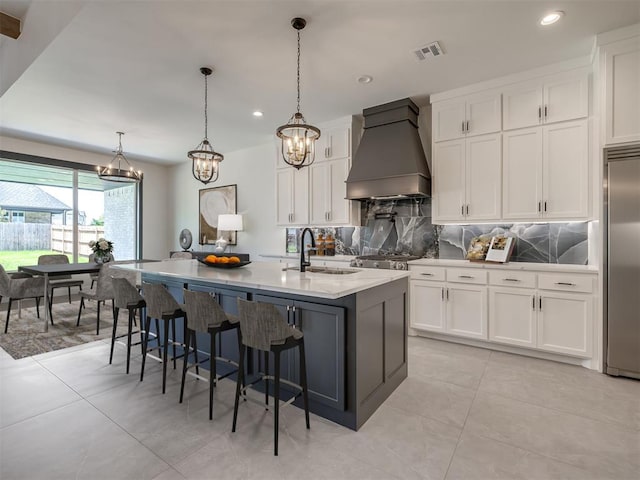 1116 Gateway Bridge Rd, Edmond, OK 73034 - kitchen featuring premium range hood, a sink, built in refrigerator, tasteful backsplash, and recessed lighting