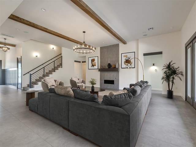 1116 Gateway Bridge Rd, Edmond, OK 73034 - living room with a chandelier, beam ceiling, stairs, and a large fireplace