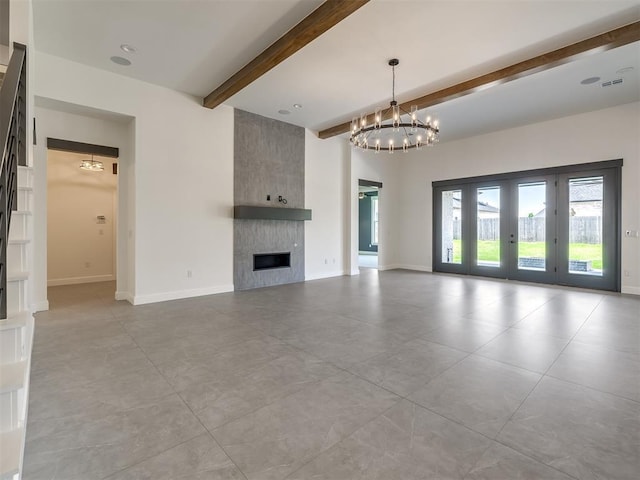 1116 Gateway Bridge Rd, Edmond, OK 73034 - unfurnished living room featuring beamed ceiling, a fireplace, a chandelier, baseboards, and tile patterned floors