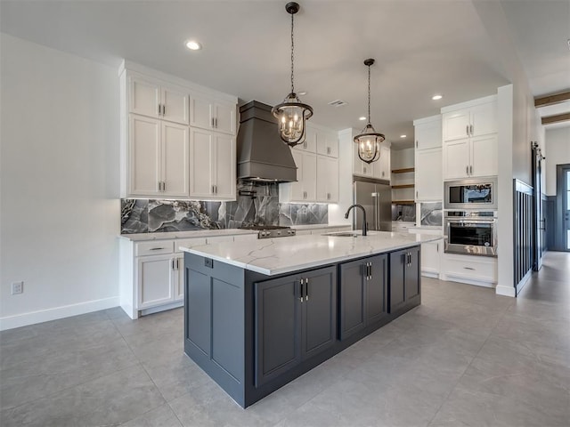 1116 Gateway Bridge Rd, Edmond, OK 73034 - kitchen featuring built in appliances, custom exhaust hood, a sink, white cabinets, and decorative backsplash