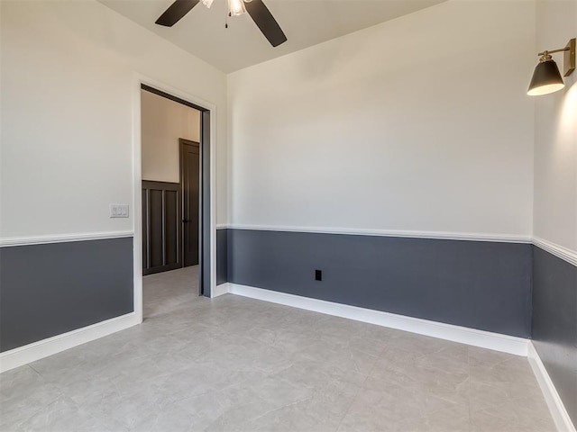 1116 Gateway Bridge Rd, Edmond, OK 73034 - spare room with a ceiling fan and baseboards