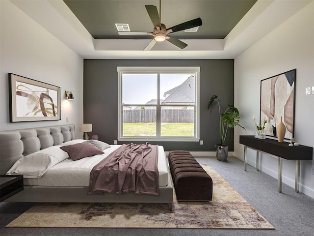1116 Gateway Bridge Rd, Edmond, OK 73034 - bedroom with a raised ceiling, carpet floors, and baseboards