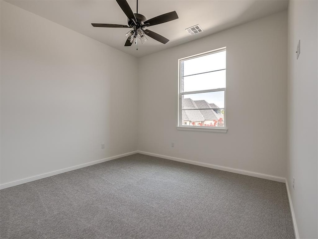 1116 Gateway Bridge Rd, Edmond, OK 73034 - spare room with baseboards, carpet, and ceiling fan