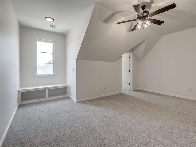 1116 Gateway Bridge Rd, Edmond, OK 73034 - bonus room with light carpet, a ceiling fan, lofted ceiling, and baseboards