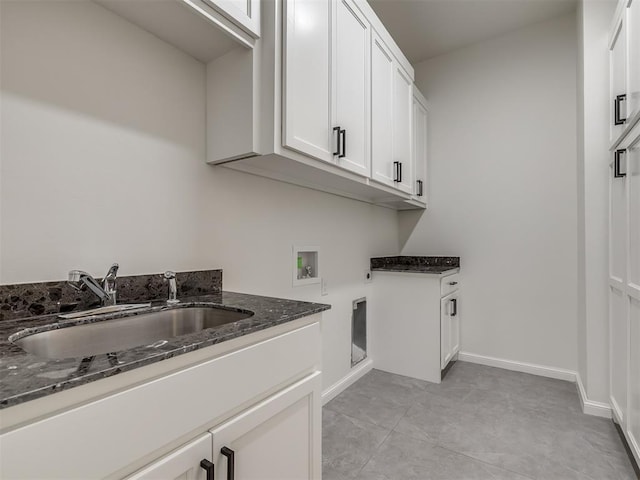 1116 Gateway Bridge Rd, Edmond, OK 73034 - laundry room featuring cabinet space, washer hookup, baseboards, and hookup for an electric dryer