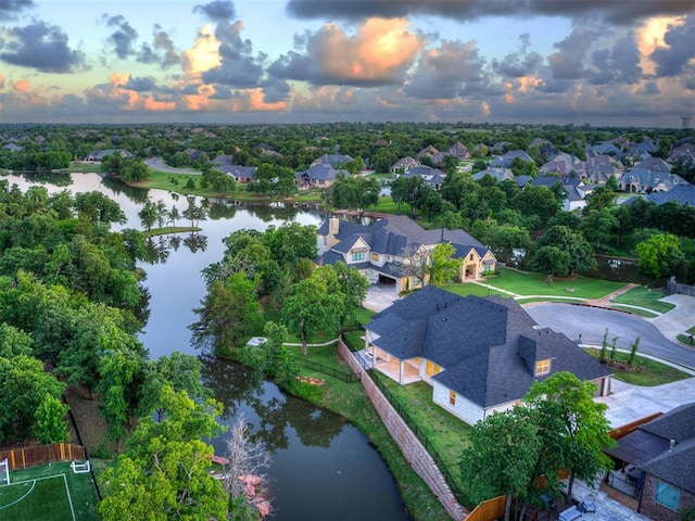 1117 Falls Bridge Ct, Edmond, OK 73034 - aerial view at dusk of a water view and a residential view