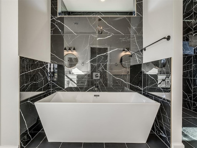 1117 Falls Bridge Ct, Edmond, OK 73034 - bathroom featuring tile walls, a freestanding bath, and a shower