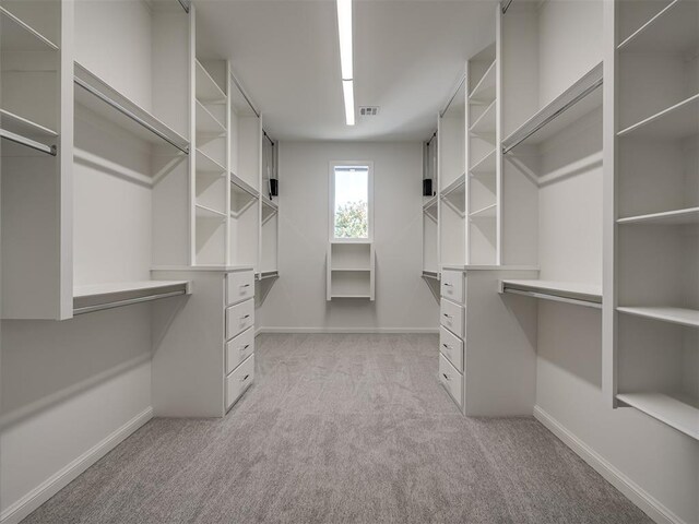 1117 Falls Bridge Ct, Edmond, OK 73034 - walk in closet with light colored carpet