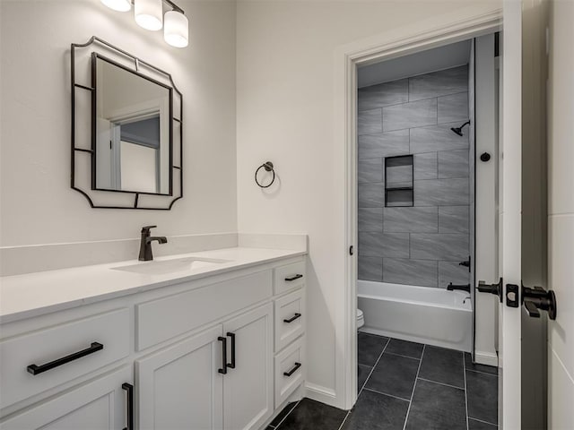 1117 Falls Bridge Ct, Edmond, OK 73034 - full bath with vanity, tile patterned floors, toilet, bathtub / shower combination, and baseboards