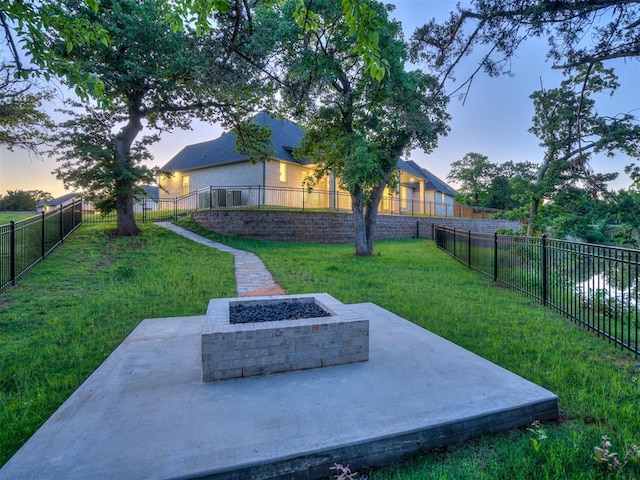 1117 Falls Bridge Ct, Edmond, OK 73034 - view of yard with an outdoor fire pit and a patio area