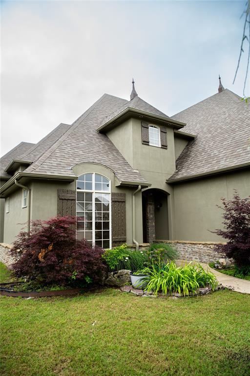 3176 E 146th Pl, Bixby, OK 74008 - rear view of property with stucco siding, a yard, and a shingled roof