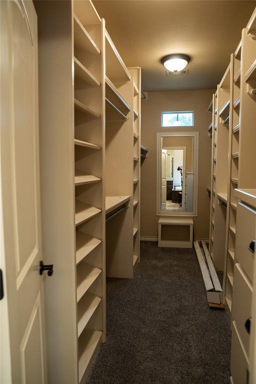 3176 E 146th Pl, Bixby, OK 74008 - spacious closet featuring dark carpet