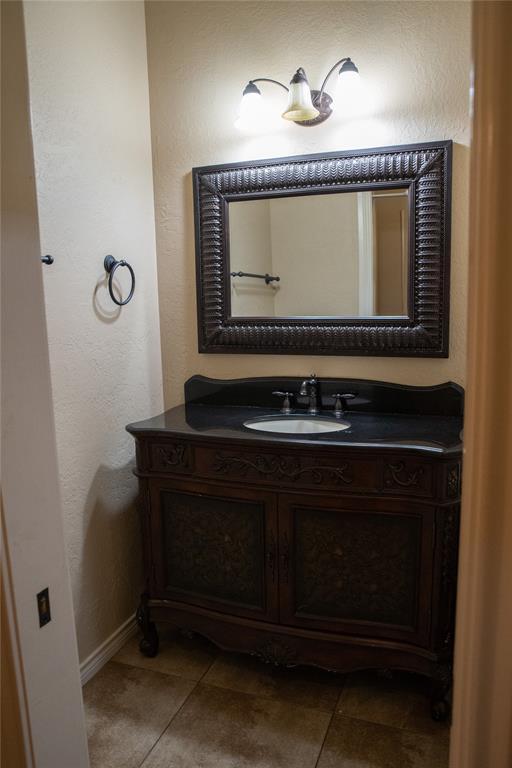 3176 E 146th Pl, Bixby, OK 74008 - bathroom featuring vanity, baseboards, and tile patterned flooring