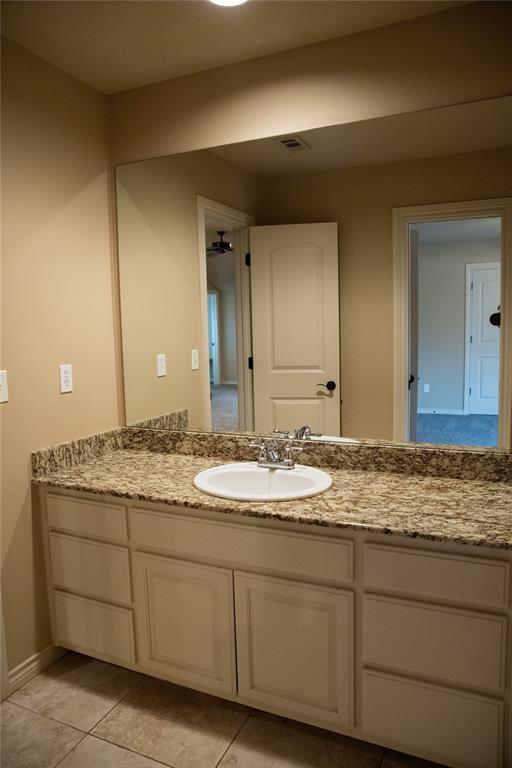 3176 E 146th Pl, Bixby, OK 74008 - bathroom featuring vanity, tile patterned floors, and baseboards