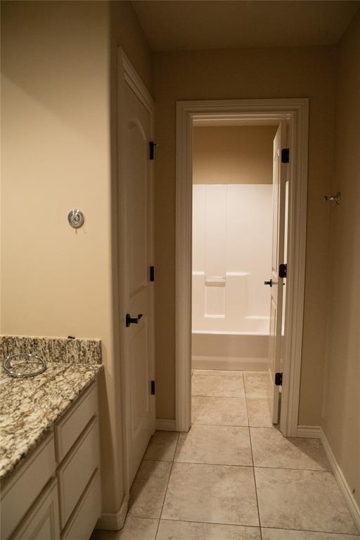 3176 E 146th Pl, Bixby, OK 74008 - bathroom featuring vanity, tile patterned floors, and baseboards