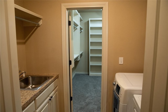 3176 E 146th Pl, Bixby, OK 74008 - laundry room featuring separate washer and dryer, carpet floors, cabinet space, and baseboards