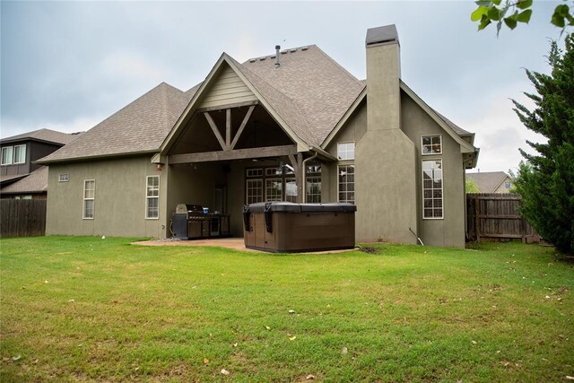 3176 E 146th Pl, Bixby, OK 74008 - back of house featuring a hot tub, a chimney, stucco siding, a patio, and roof with shingles