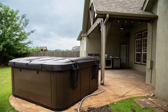 3176 E 146th Pl, Bixby, OK 74008 - view of patio with a ceiling fan and a hot tub