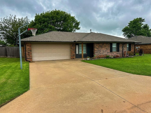 1913 Linwood St, Weatherford, OK 73096 - ranch-style home with a garage, concrete driveway, brick siding, and roof with shingles