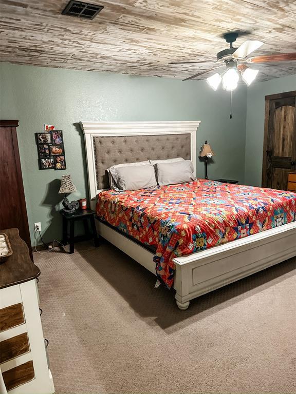 1913 Linwood St, Weatherford, OK 73096 - carpeted bedroom featuring ceiling fan