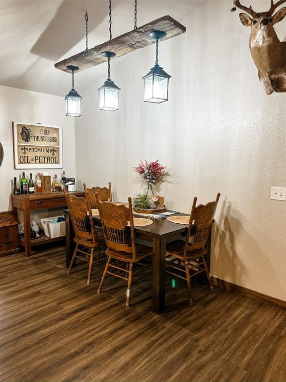 1913 Linwood St, Weatherford, OK 73096 - dining space with dark wood finished floors and baseboards