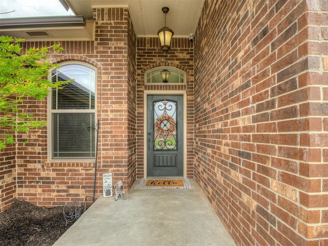 14512 Briarcliff St, Oklahoma City, OK 73170 - doorway to property featuring brick siding