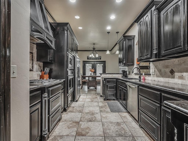 14512 Briarcliff St, Oklahoma City, OK 73170 - kitchen featuring stainless steel appliances, dark cabinetry, a sink, backsplash, and crown molding