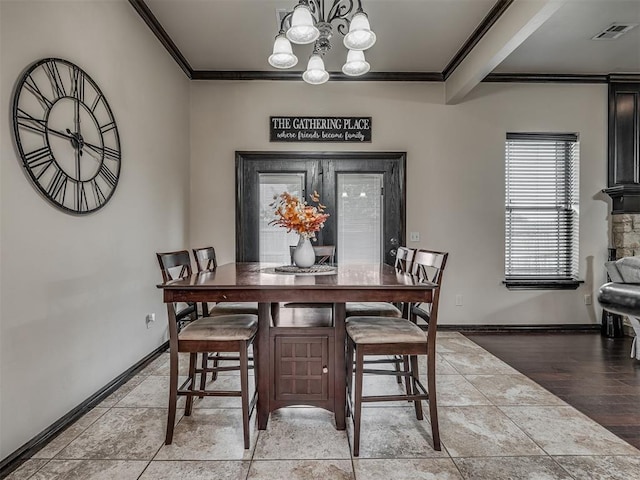 14512 Briarcliff St, Oklahoma City, OK 73170 - dining area featuring ornamental molding, a chandelier, and baseboards