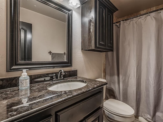 14512 Briarcliff St, Oklahoma City, OK 73170 - bathroom with vanity, toilet, a textured wall, and a shower with curtain
