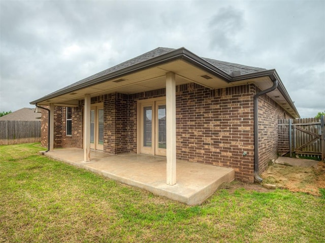 14512 Briarcliff St, Oklahoma City, OK 73170 - back of house with a patio and brick siding
