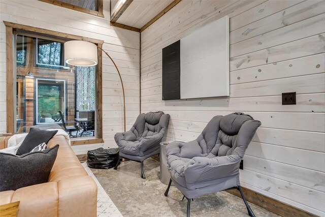 166 Morning Berry Trl, Broken Bow, OK 74728 - living room with wood walls and concrete floors