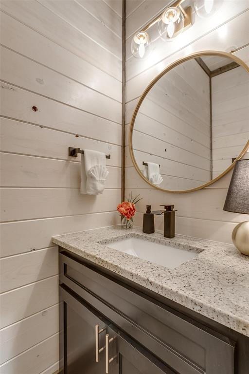 166 Morning Berry Trl, Broken Bow, OK 74728 - bathroom with vanity and wooden walls