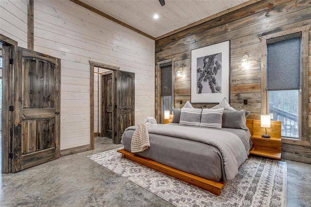 166 Morning Berry Trl, Broken Bow, OK 74728 - bedroom with wooden walls, concrete flooring, and recessed lighting