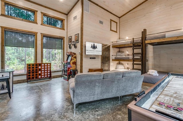 166 Morning Berry Trl, Broken Bow, OK 74728 - living area featuring wood walls, high vaulted ceiling, finished concrete floors, and wood ceiling