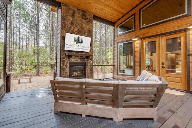 166 Morning Berry Trl, Broken Bow, OK 74728 - wooden terrace featuring an outdoor living space with a fireplace