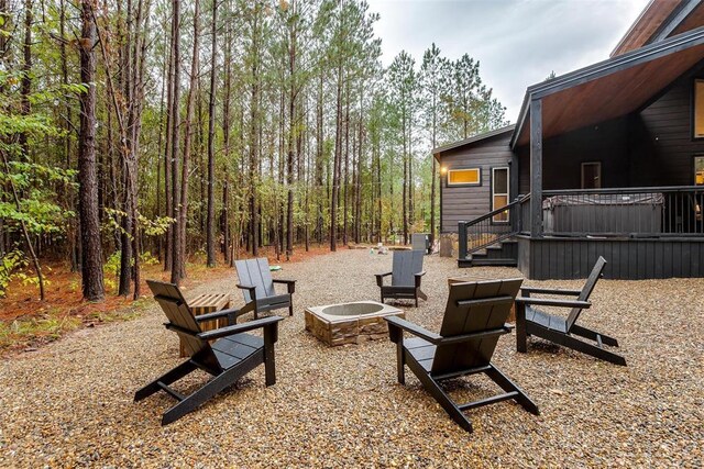 166 Morning Berry Trl, Broken Bow, OK 74728 - view of patio / terrace with a fire pit and a deck