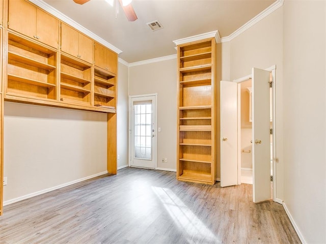 400 W 10th St, Edmond, OK 73003 - empty room featuring light wood-type flooring, a ceiling fan, baseboards, and crown molding