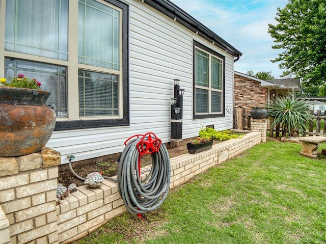 3109 SW 45th St, Oklahoma City, OK 73119 - view of side of property with a lawn