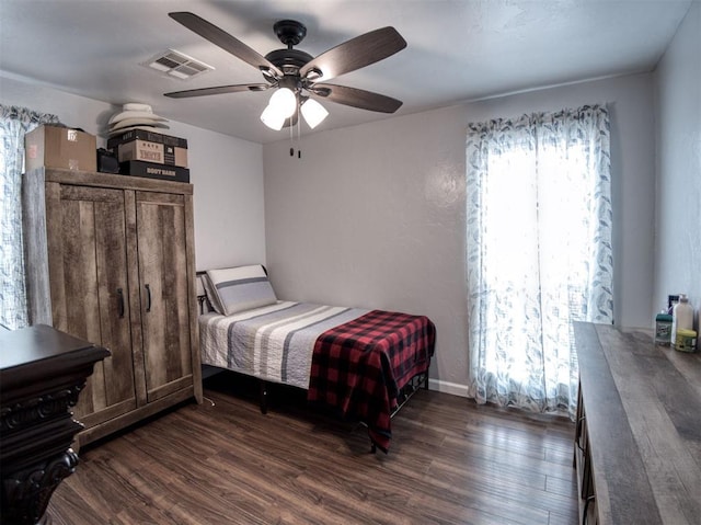 3109 SW 45th St, Oklahoma City, OK 73119 - bedroom with dark wood finished floors, a ceiling fan, and baseboards