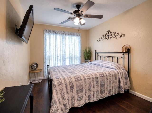 3109 SW 45th St, Oklahoma City, OK 73119 - bedroom featuring wood finished floors, a textured wall, ceiling fan, and baseboards